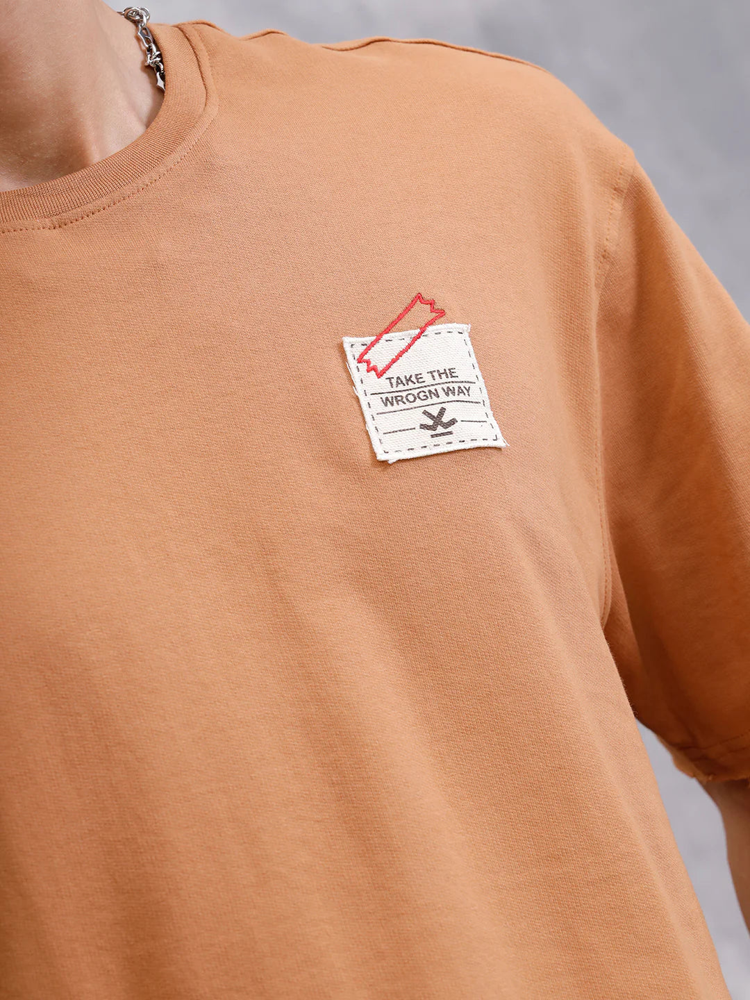 Solid Oversized T-Shirt With Printed Canvas Patch And Raw Edge Detail | Brown