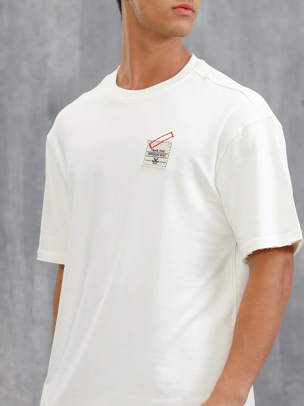 Solid Oversized T-Shirt With Printed Canvas Patch And Raw Edge Detail  | Off White