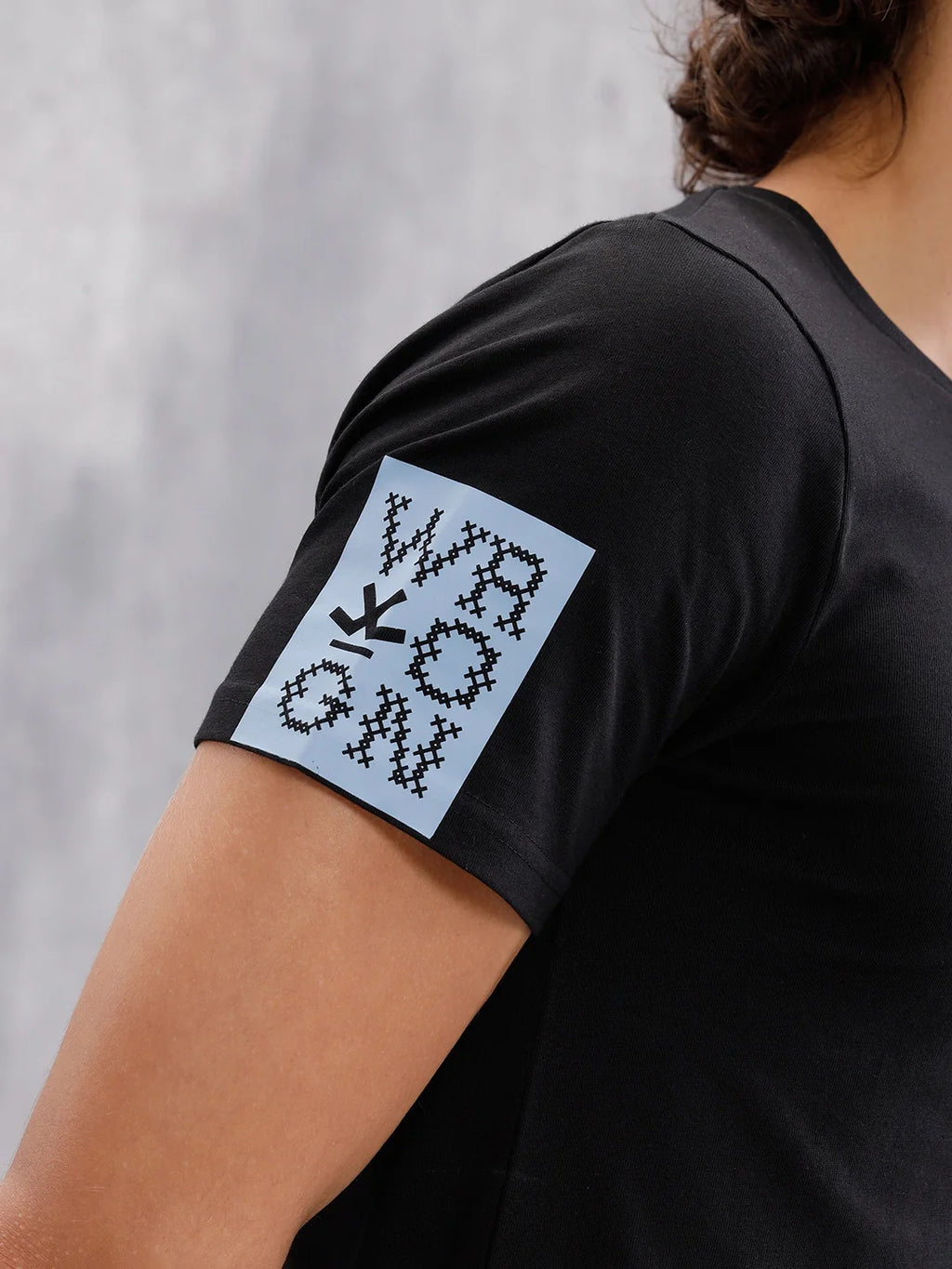 Solid Crew Neck With Contrast Stitch And Print Detail  |  Black