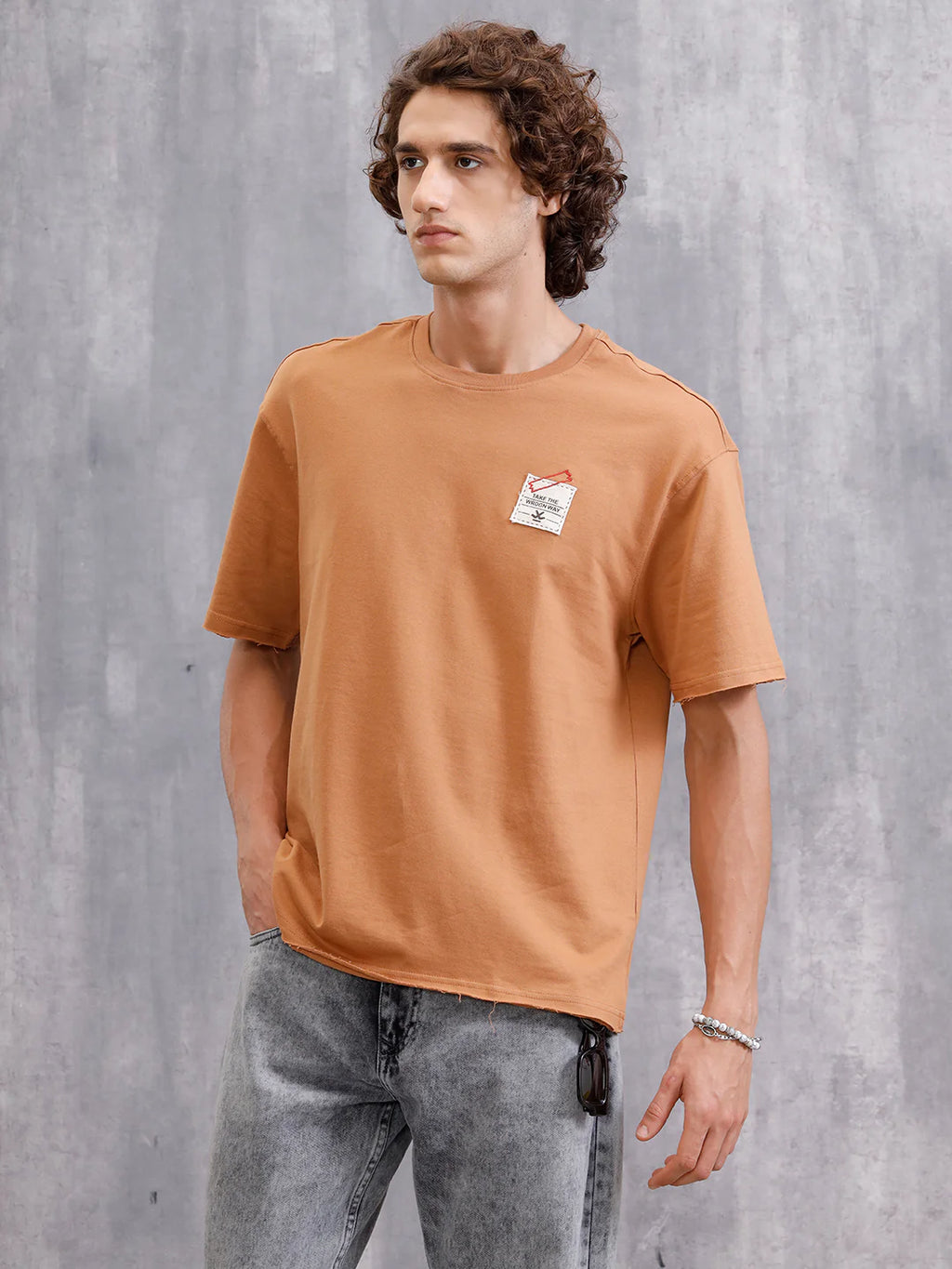 Solid Oversized T-Shirt With Printed Canvas Patch And Raw Edge Detail | Brown