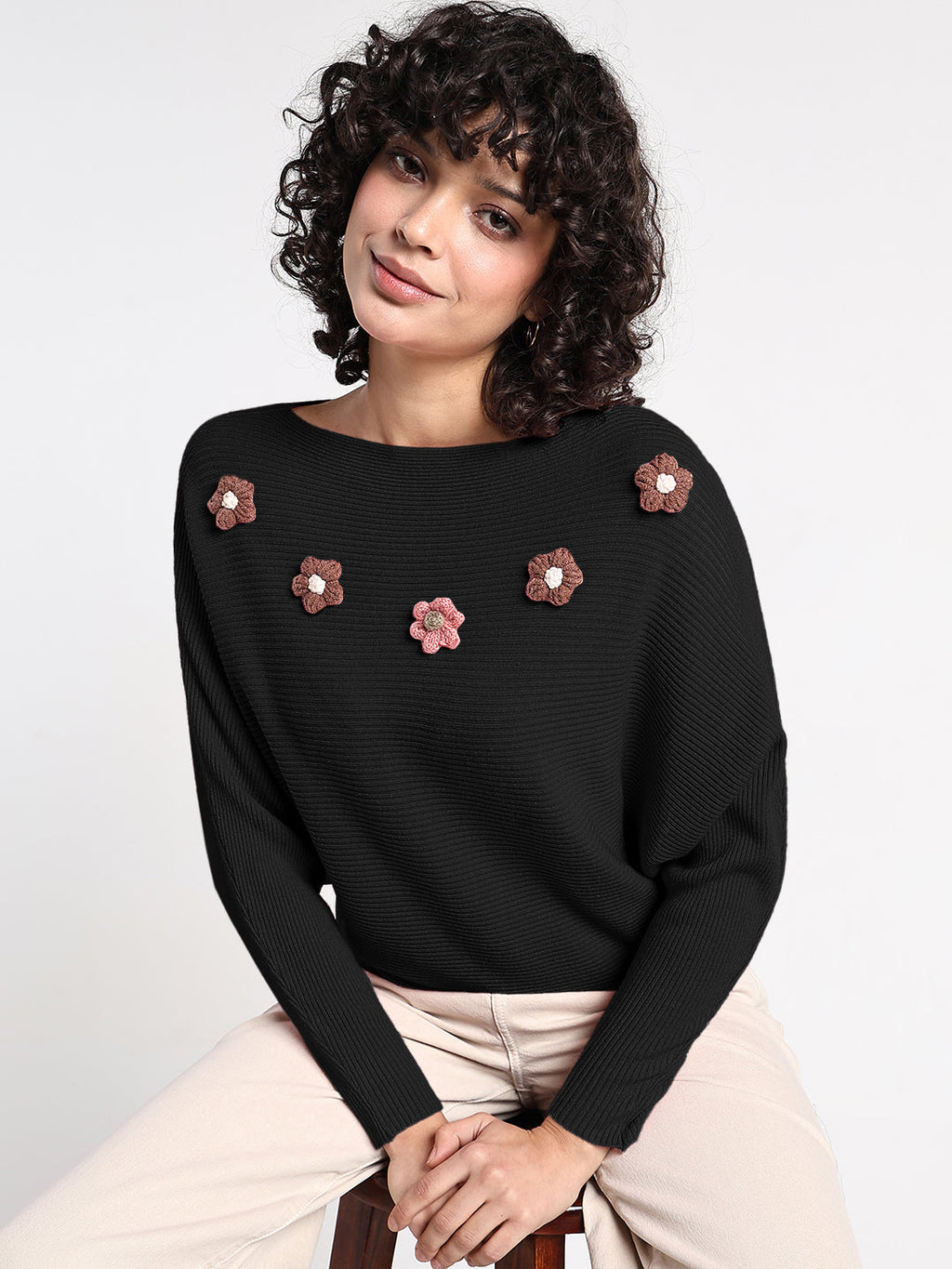 Women's Black Textured Knit Top with Flower Applique Detail