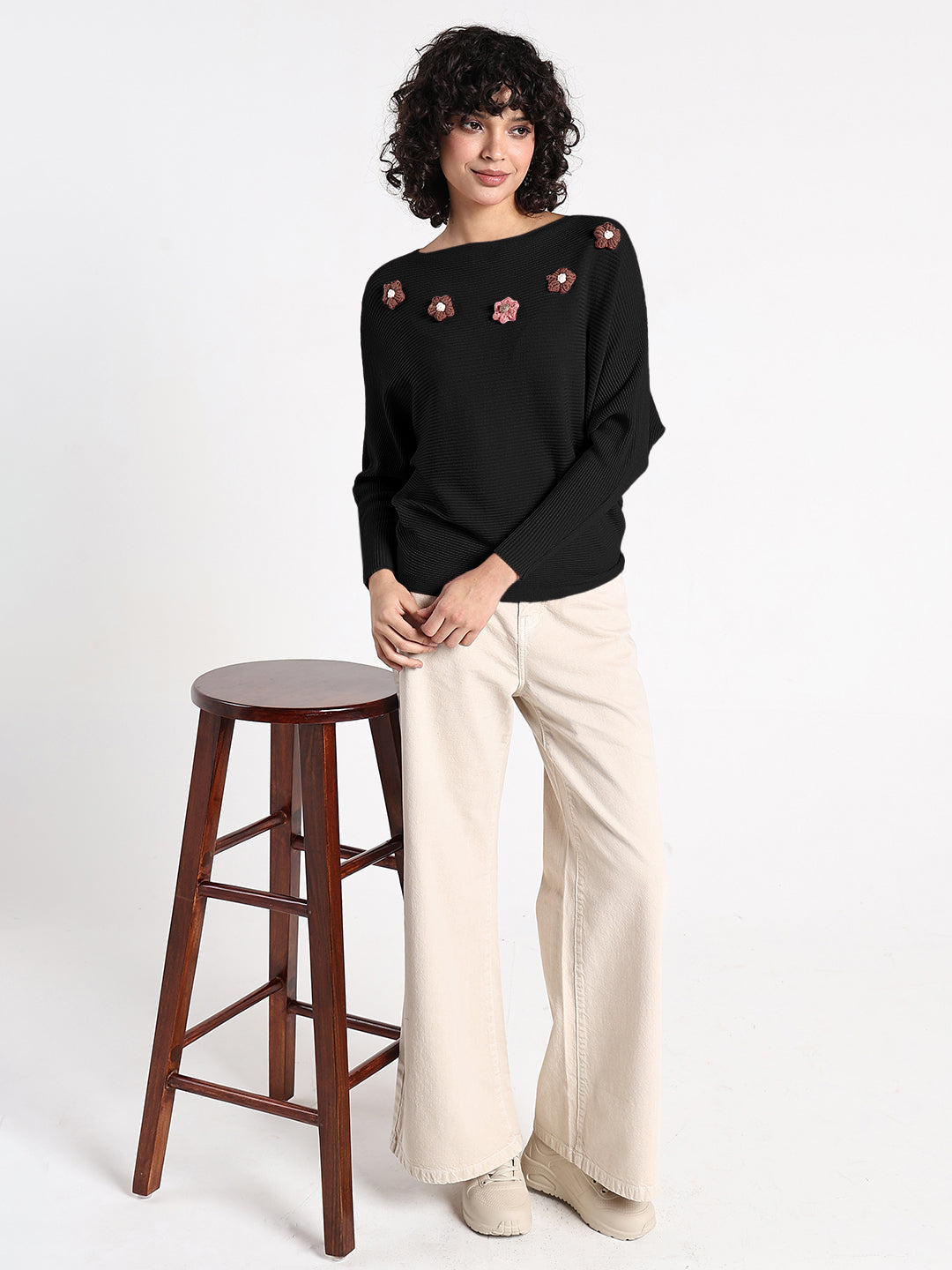 Women's Black Textured Knit Top with Flower Applique Detail